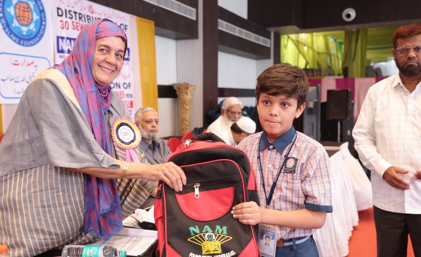 School bag distribution to a NAM Foundation student